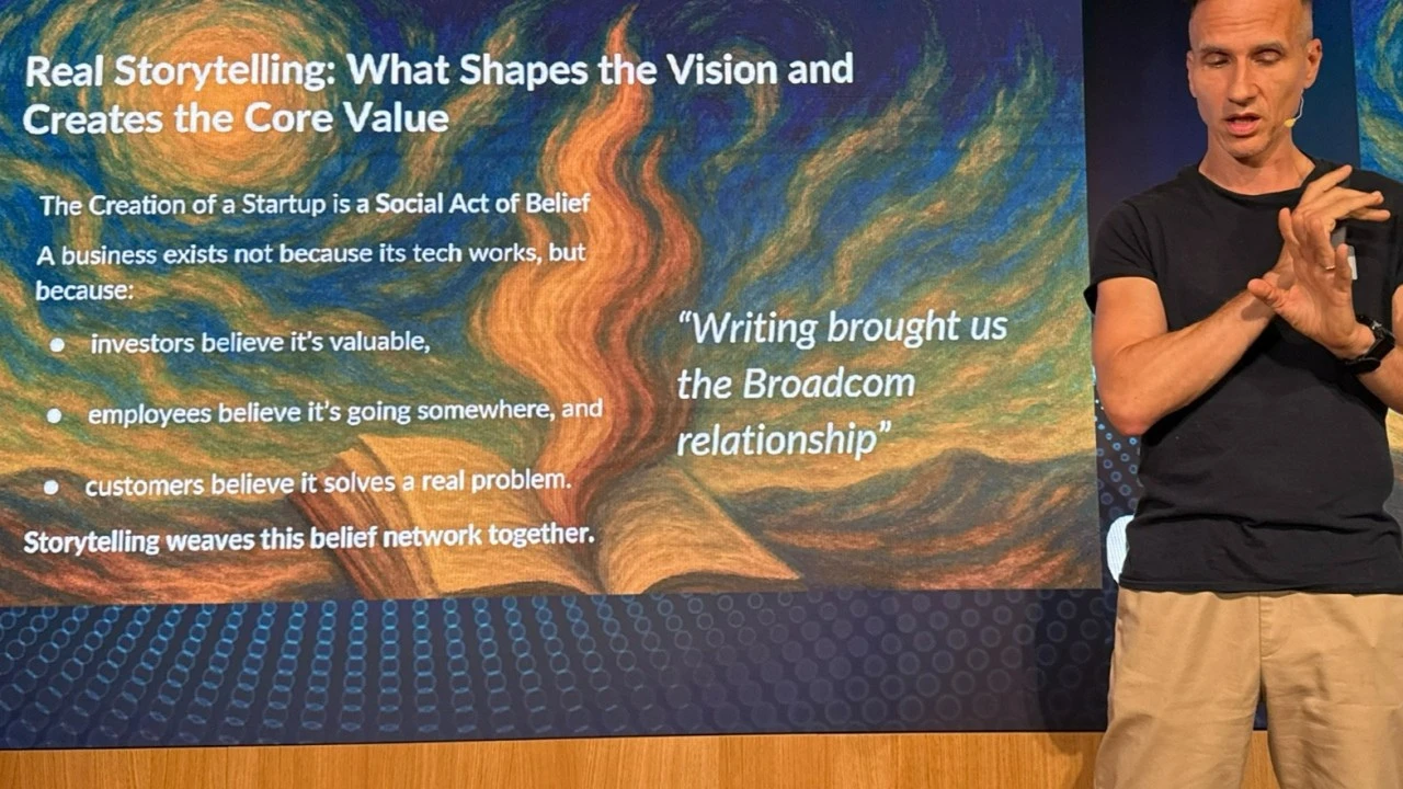 Laurent Balmelli on stage beside his slide "Real Storytelling: What Shapes the Vision and Creates the Core Value"
